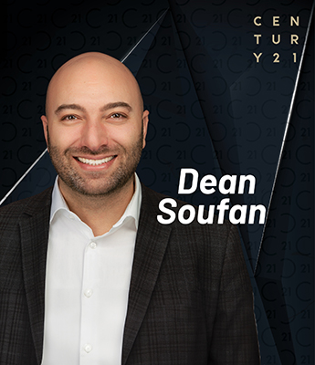 Professional headshot of Dean Soufan, a smiling, bald man with a trimmed beard, wearing a dark plaid suit jacket over a white dress shirt. His name 'Dean Soufan' appears in bold white text to the right. The background features a dark, stylized Century 21 logo pattern with 'CENTURY 21' displayed vertically in the top right corner.
